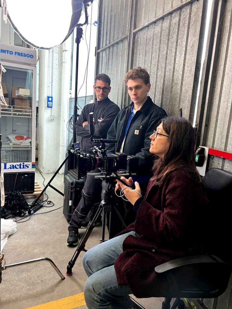 Arc Media crew adjusting the camera during the Lactalis warehouse shoot