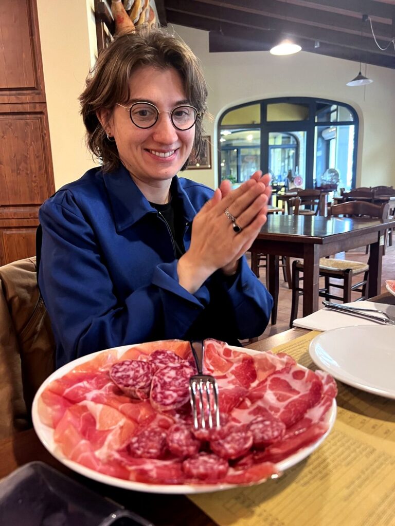 Arc Media crew member with a large plate of Parma prosciutto