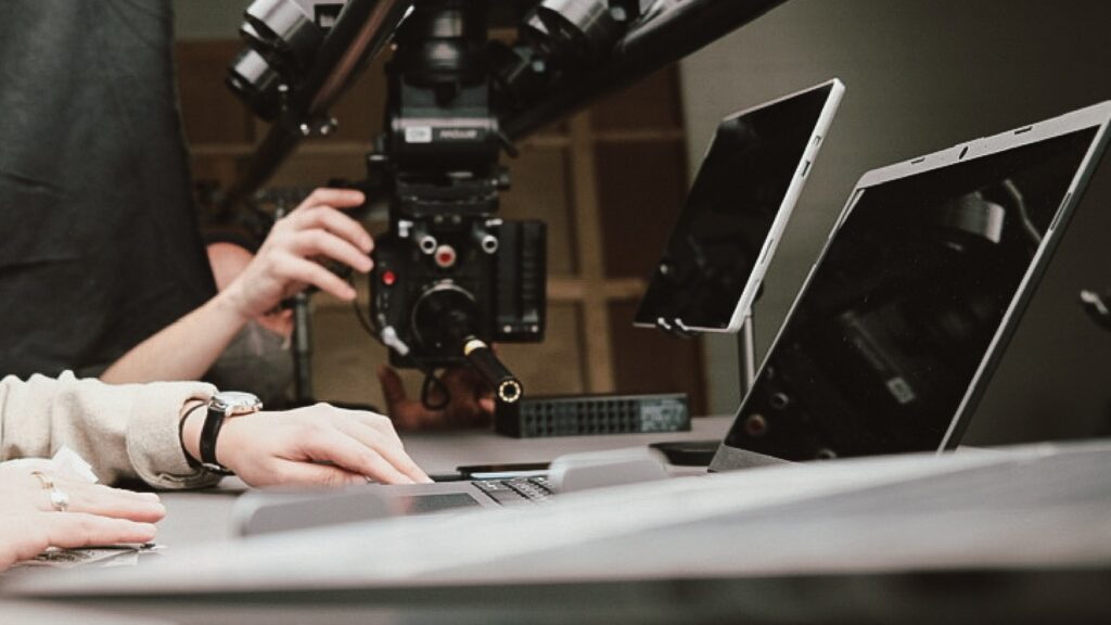 Behind the scenes of the probe lens shot: the camera rigged overhead with the probe lens aimed down at the laptop keyboard