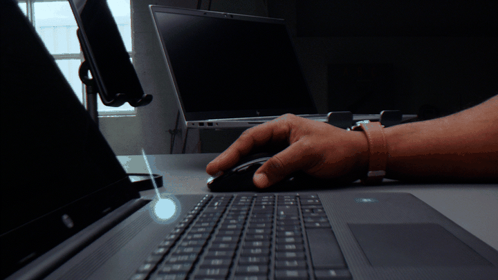 Animated shot of tracked motion graphics following a probe lens camera move across the desk