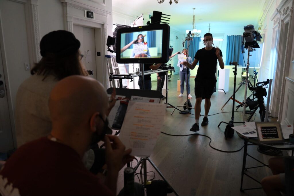 Gaffer rigging lights on set