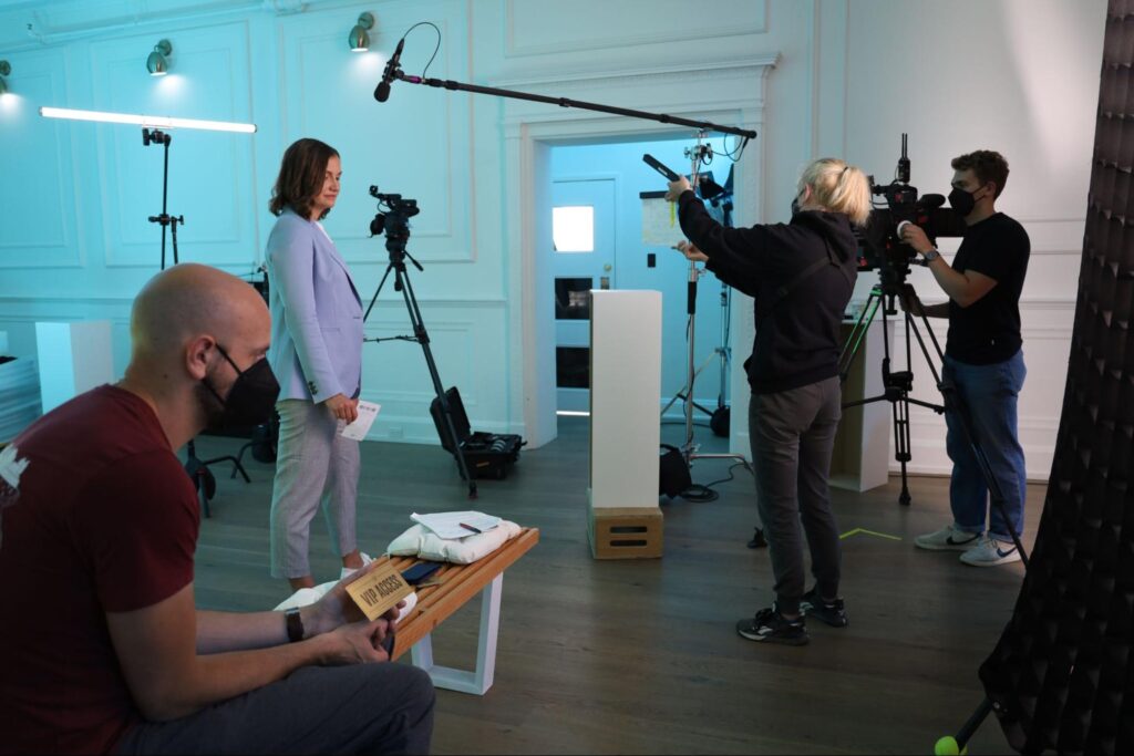 Camera team blocking a shot
